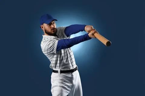 Focused baseball player swinging bat with power and precision, athletic sport Stock Photos