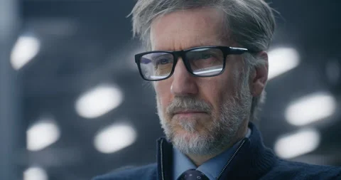 Focused, Bespectacled Male Data Analyst Intently Checking Real Time Performance Stock Footage 325422128