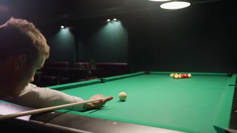 Focused Billiard Player Preparing Break Shot on Green Pool Table Stock Footage 304962922