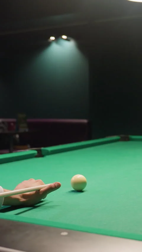 Focused Billiard Player Preparing Break Shot on Green Pool Table Stock Footage 319789561