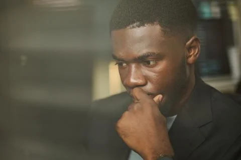 Focused Black Man Working on Computer in Cybersecurity Office Stock Photos