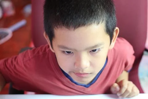 Focused Boy Engaged in Creative Activity Foto stock