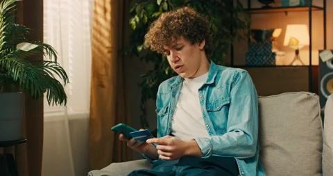 The focused boy takes final steps in the wire transfer to complete the 動画素材 218241105