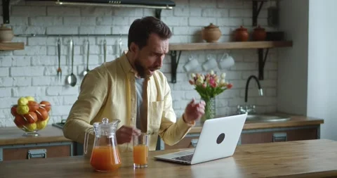 Focused business man getting bad results on computer at home office. Shocked Stock Footage 170565470