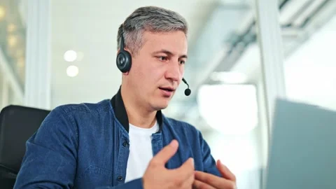 Focused Businessman With Headset Working Remotely From Modern Office Stock-Footage 319245908