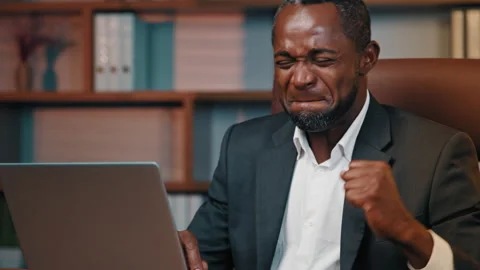 Focused businessman office worker typing on laptop happy male winner reads good Stock Footage 209458066