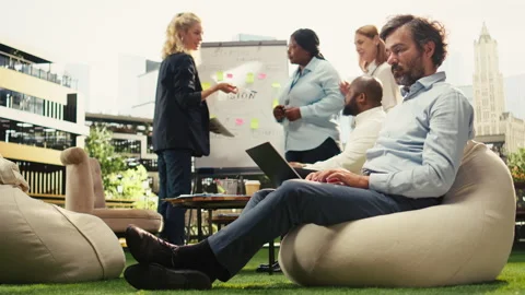 Focused businessman sitting and thinking about tasks on laptop Stock Footage 338386330