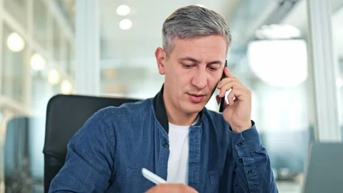 Focused Businessman Talking On Phone While Working In Modern Office Stock-Footage 320036834