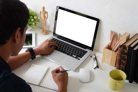 Focused businessman using laptop computer at bright modern office.. Stock-Fotos