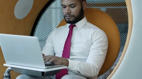 Focused businessman using laptop Video stock 116818359