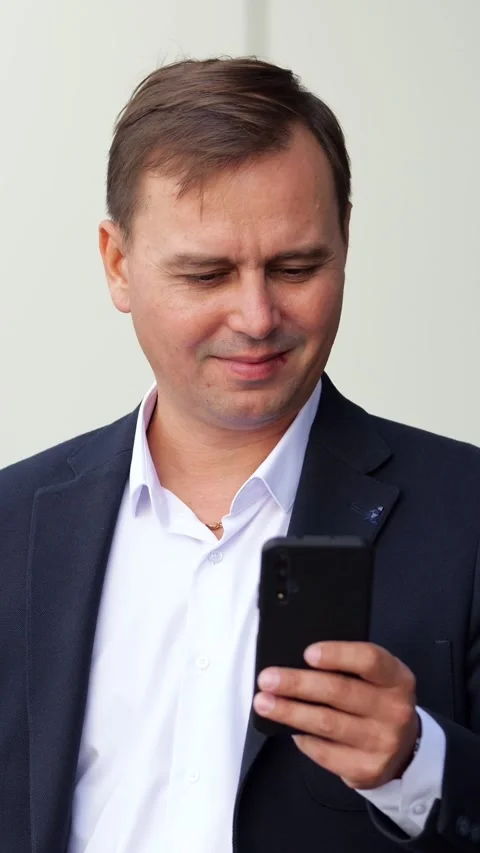 Focused businessman using smartphone for communication Stock Footage 341184137