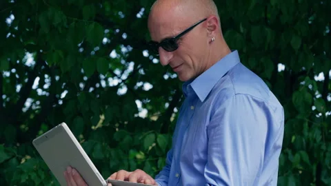 Focused Businessman Using Tablet Computer Standing Outdoors Stock Footage 339033008