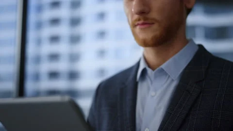 Focused businessman working digital tablet in office. Young business man Stock Footage