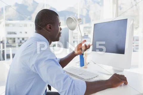 Focused businessman working at his desk on video chat Stock Photos