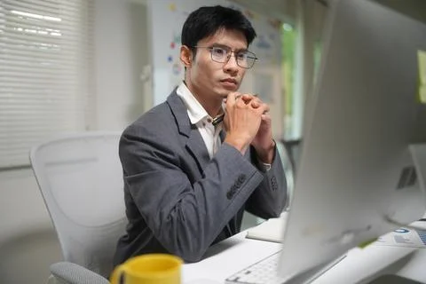 Focused Businessman Working at Office Computer Stock Photos