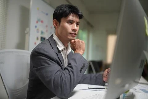 Focused Businessman Working at Office Computer Stock Photos
