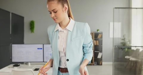 Focused businesswoman analyst checking data and paperwork at computer in office Stock Footage 341900696