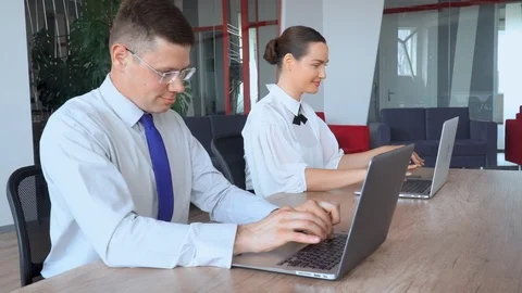 Focused candid managers typing on computers Stock Footage 116526036