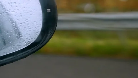 Focused Car Rearview Mirror during a Rain. Slow Motion Video stock 90777948