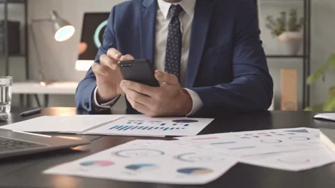 Focused CEO Balances Digital and Paper Work in the Modern Office Stock-Footage 321036318
