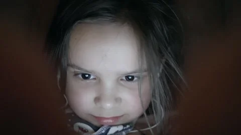 A Focused Child Deeply Engrossed in Engaging and Enjoyable Screen Activity and Stock Footage 305459826