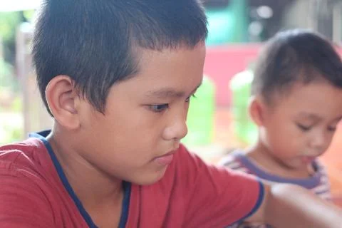 Focused Child Engaged in Creative Activity Stock Photos