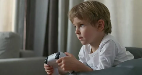 Focused child playing video game Stock Video Pond5