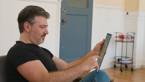 Focused Close Up POV of a Male working on a Tablet Job Searching Stock Footage 211792844