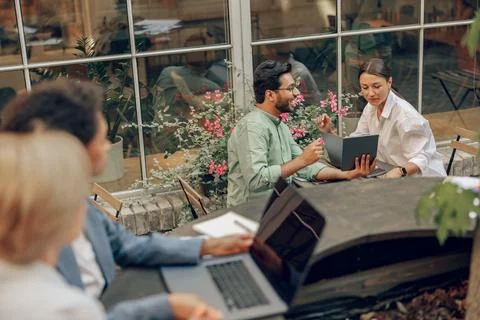 Focused colleagues working together developing business strategy for project on Stock Photos