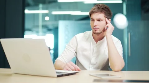 Focused concentrated developer typing on laptop in at workplace in office.  Stock Footage 229092621
