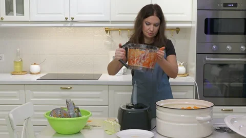 Focused Cook Effortlessly Shreds Vegetables for Sauerkraut in Modern Kitchen Stock Footage 321152930