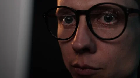 Focused crypto trader in glasses analyzing bitcoin volatility, chart data Stock Footage 310668975