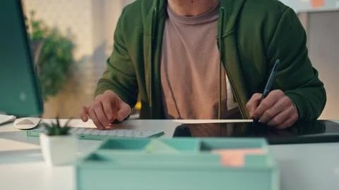 Focused designer working computer office closeup. Creator hands drawing tablet Stock Photos