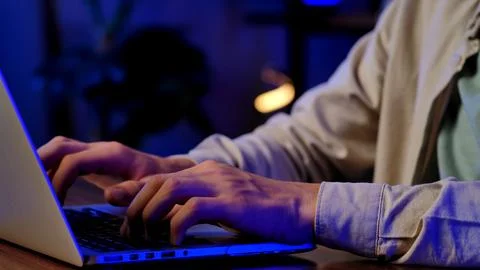 Focused Developer Typing Code on a Laptop Keyboard 스톡 사진