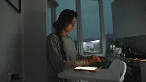 Focused developer works diligently in tranquil apartment setting 動画素材 323466121