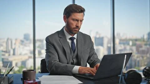 Focused director working computer analysing report data. Office manager typing Stock Photos