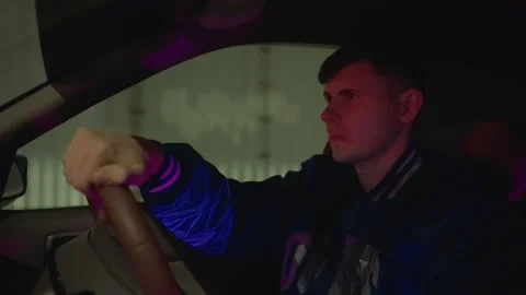 Focused driver navigates tranquil night shift peacefully, Nighttime driver Stock Footage 327355640