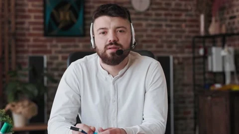 Focused Employee of helpline technical support helps to client distantly through Stock Footage 166702005