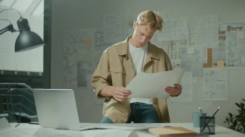 Focused Engineer with Drawings in Office. Instruments and Office for Designer. Stock Footage 239103800