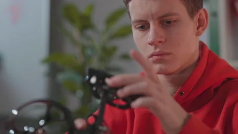 Focused engineer piecing modern drone. Complicated project. Shooting of clever Stock Footage 186144843