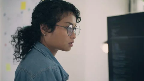 Focused engineer programming artificial intelligence software on computer. Stock Footage 319001583