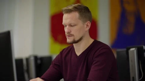 Focused engineer working on computer Stock Footage 142163339