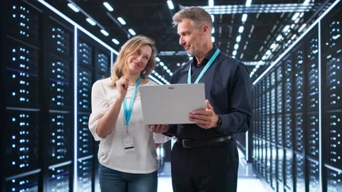 Focused Engineers Checking Data Servers Stock Footage 337226182