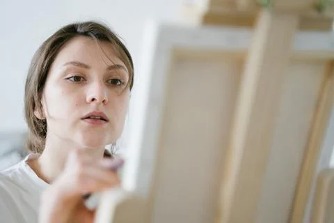 The focused face of the artist. Creative process. Talented entrepreneur draws Stock Photos