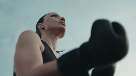 Focused Female Boxer Preparing for Training Outdoors Stock Footage 278048278