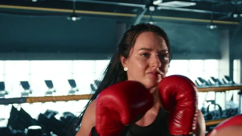 Focused Female Boxer Training in the Ring at High Frame Rate Stock Footage 268835213