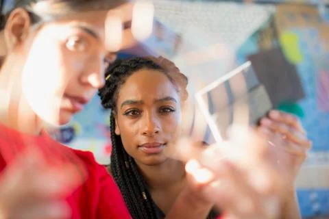 Focused female engineers examining prototype Stock Photos