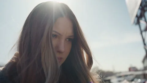 Focused female face with background. Upclose shot of woman showing intense Stock Footage 342427241