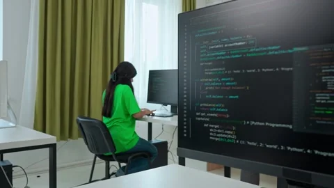 Focused Female Student Programming on Computer in Classroom Stock Footage 281071800