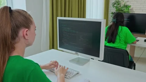 Focused Female Student Programming on Computer in Classroom Stock Footage 281071980